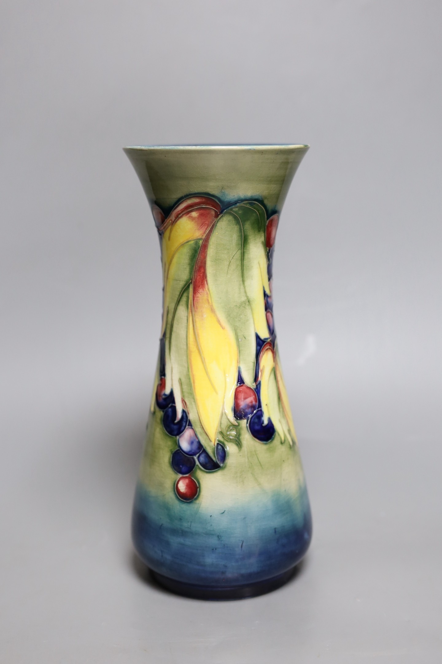 A Moorcroft leaf and berry vase, 26cm